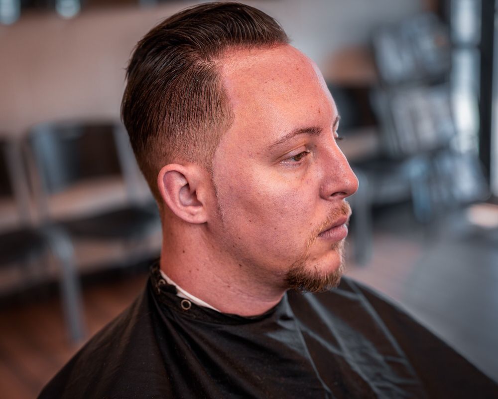Sharp taper haircut and beard line-up at Choppers Barbershop